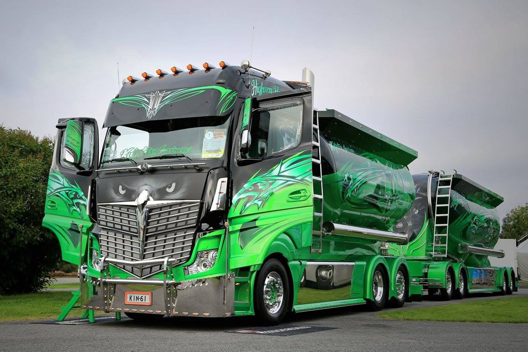 Semi truck — tanker semi in green/black dragon printed wrap (sign company).