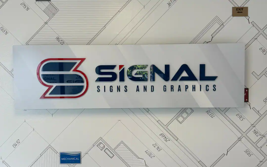 indoor acrylic signage installed in an office wall