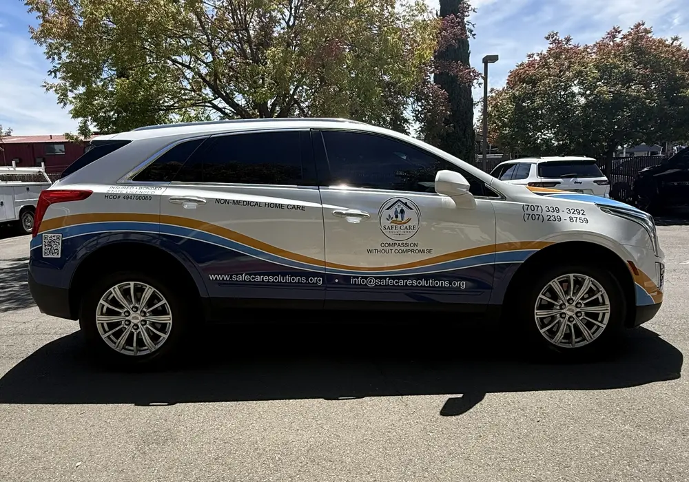 company car with logo decals on it