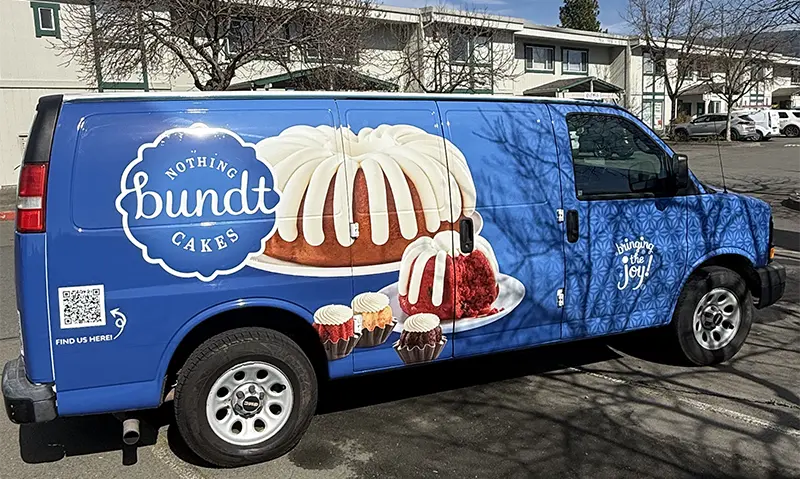 Van covered with branded vinyl wrap